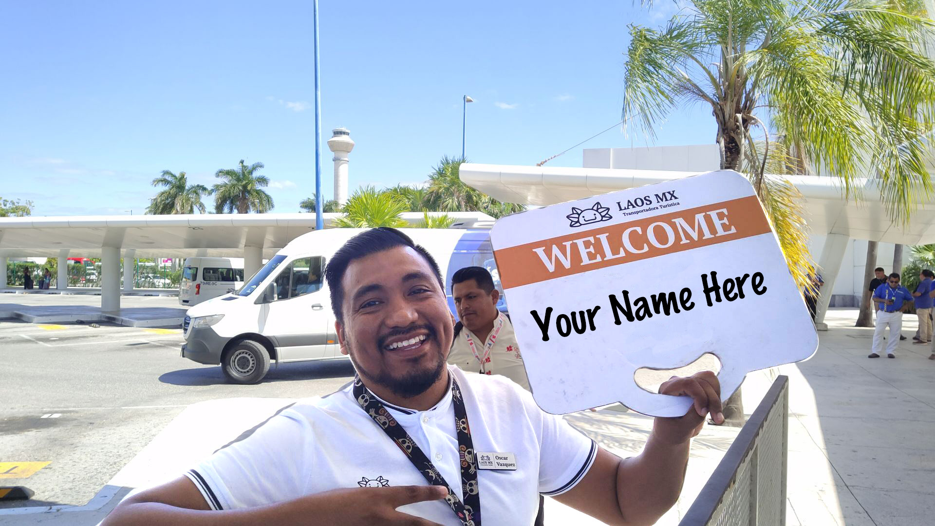 Oscar smiling next to the van